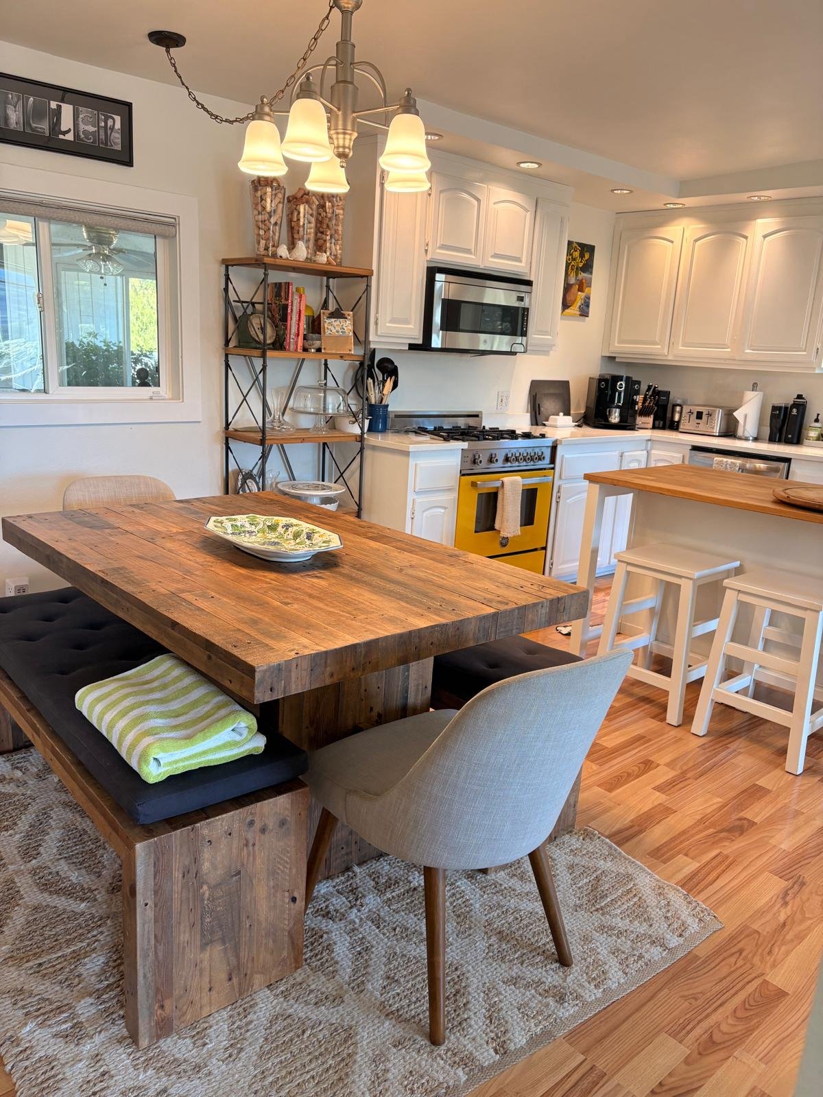 Bright open living room with white sectional and polished concrete floors after a Napa Valley home cleaning