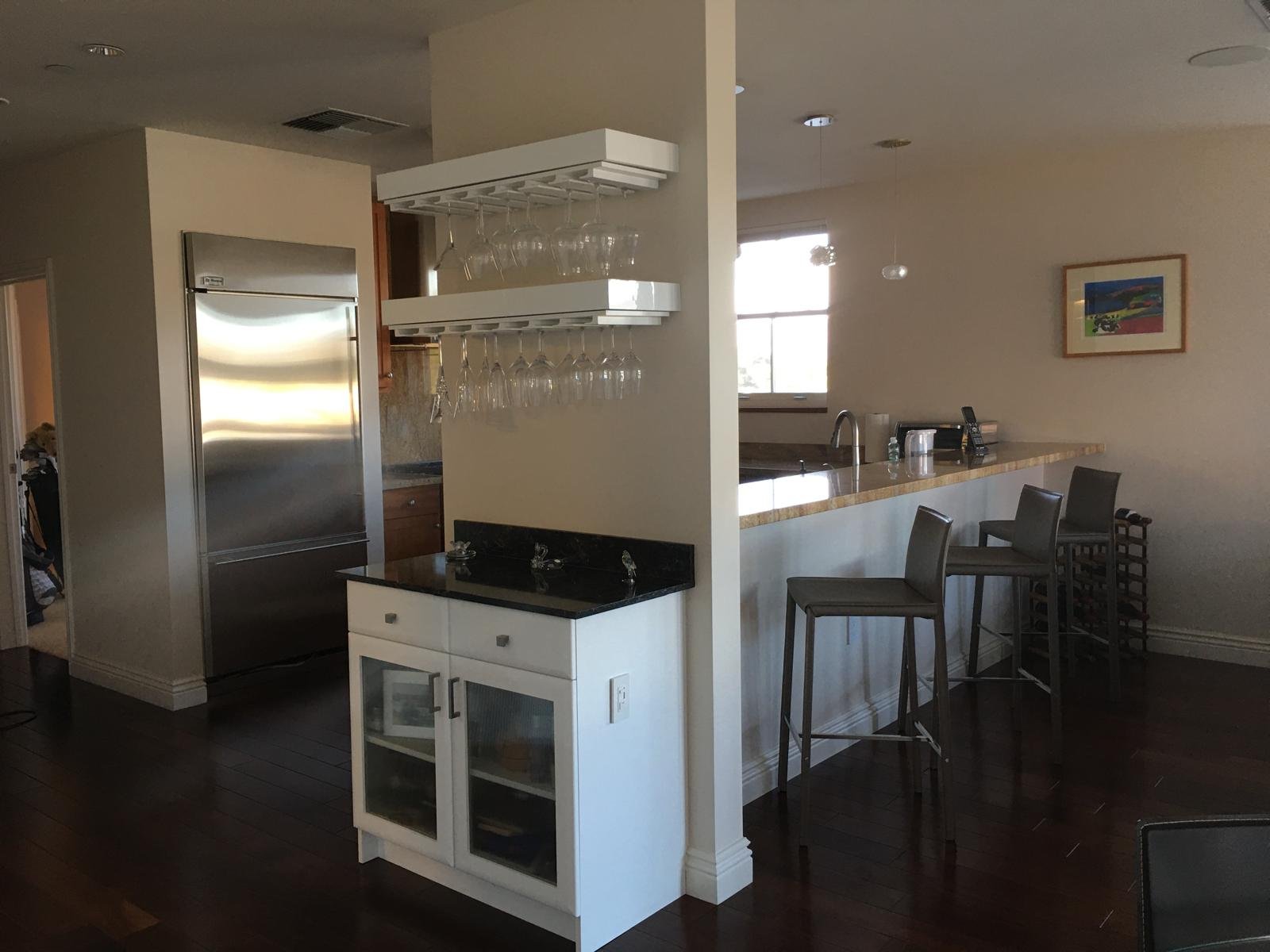 Sparkling kitchen island with barstools and pendant lighting after a professional cleaning in Napa, CA