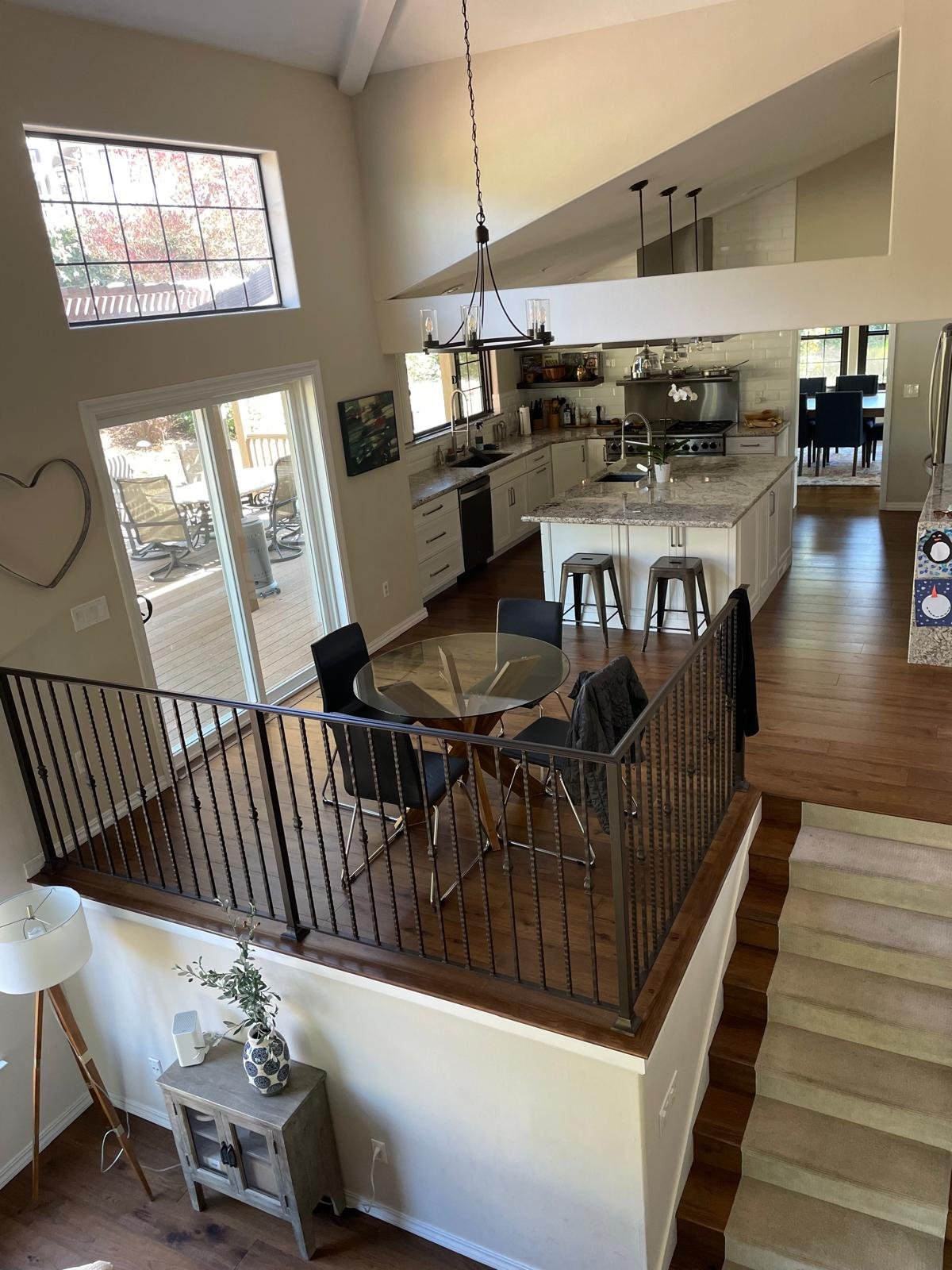 Formal dining room with navy chairs and wide-plank hardwood floors cleaned in Napa, CA